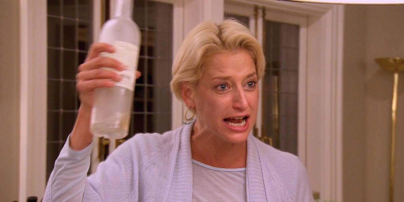 Dorinda Medley's holds an empty wine bottle while crying on 'The Real Housewives of New York City'.