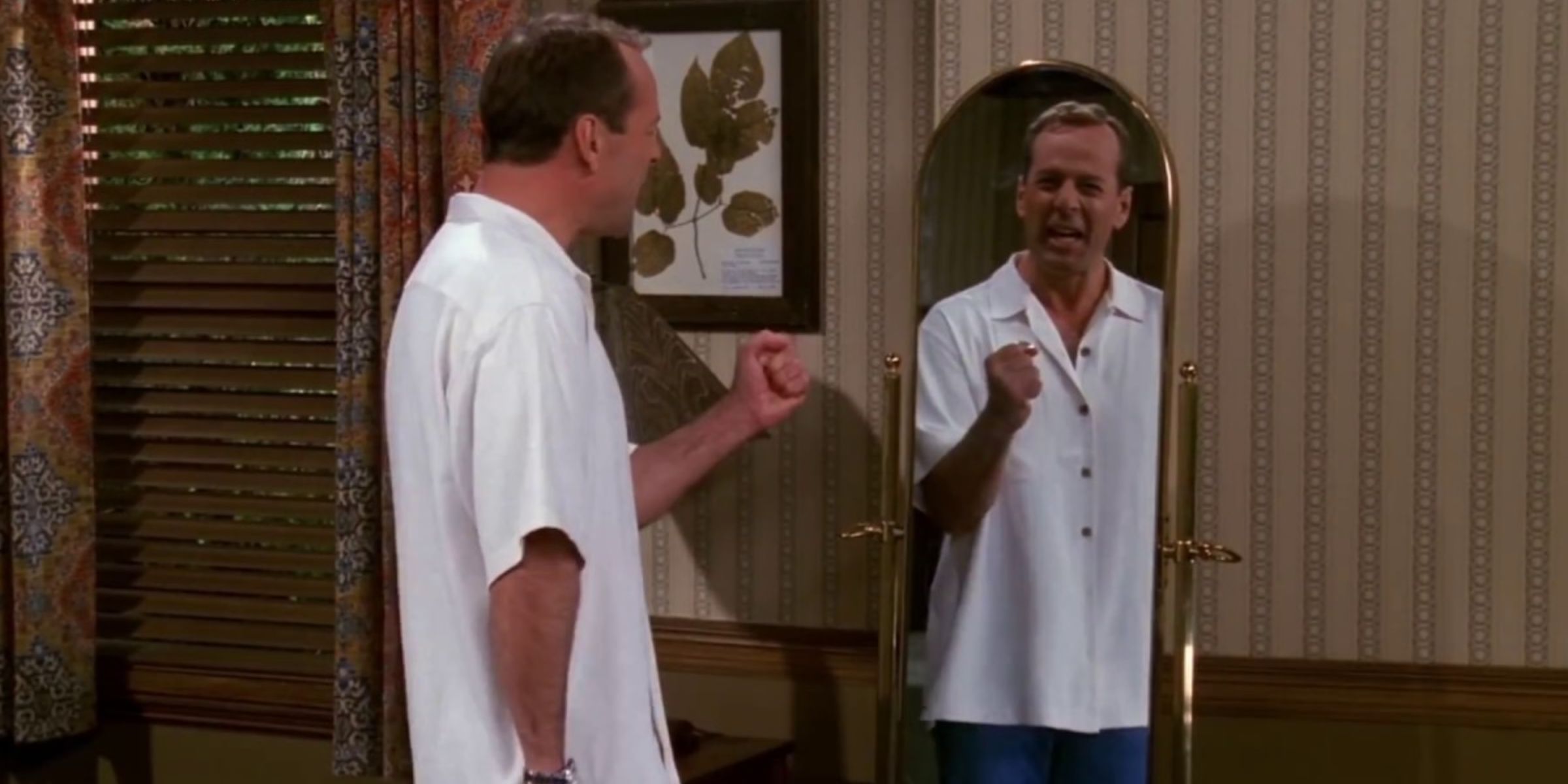 Paul (Bruce Willis) talking to himself in a mirror on Friends