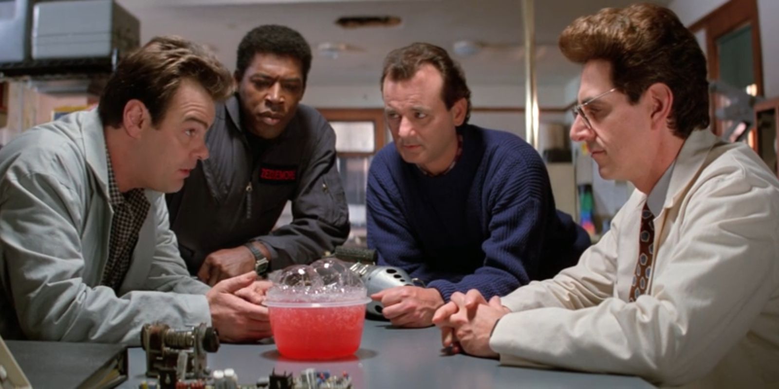 The Ghostbusters gather around a tub of slime in 'Ghostbusters II'.