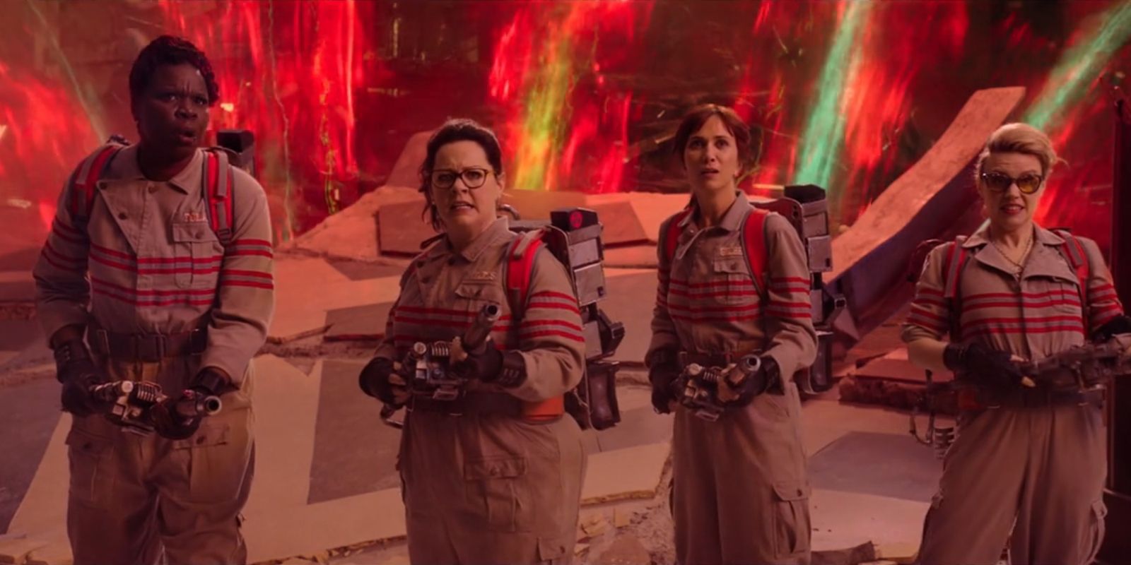 Patricia Tolan, Abigail Yates, Erin Gilbert and Jillian Holtzmann stand side-by-side with their proton packs on in 2016's 'Ghostbusters'.