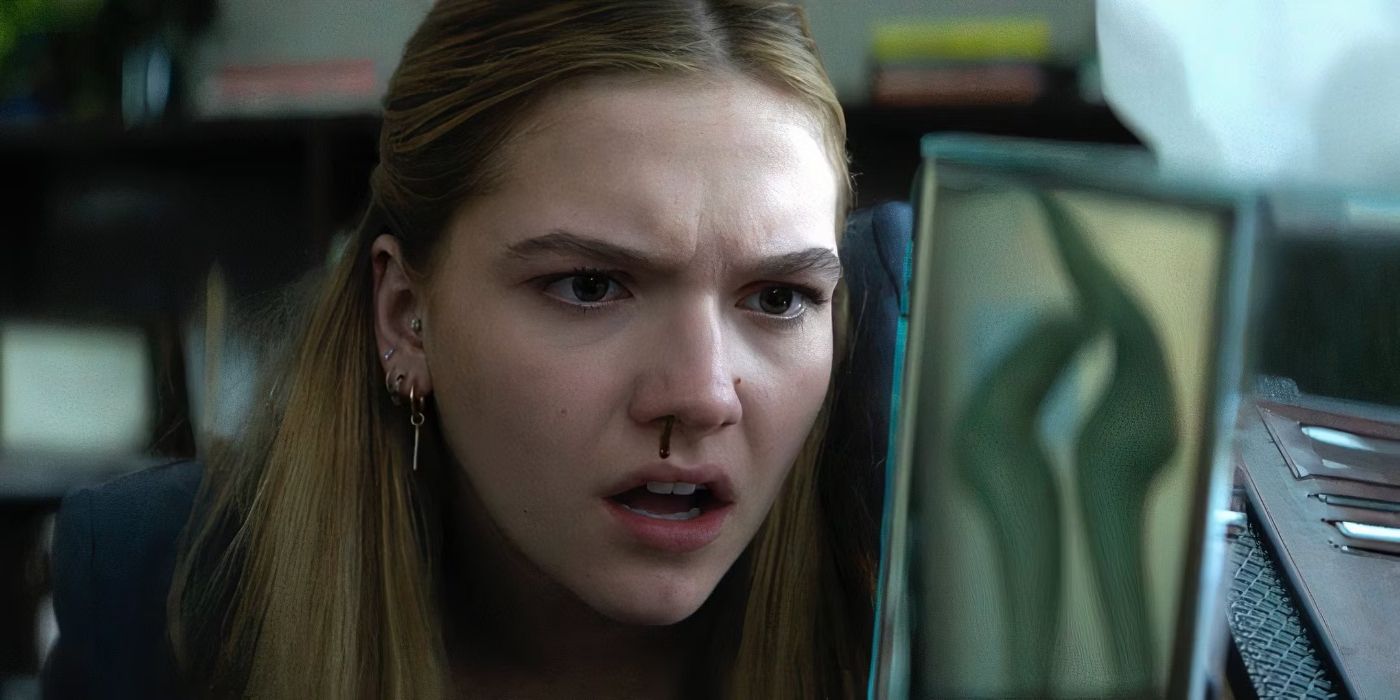 Cece (Jayden Bartels) staring into a small mirror as blood drips from her nose in Goosebumps: The Vanishing