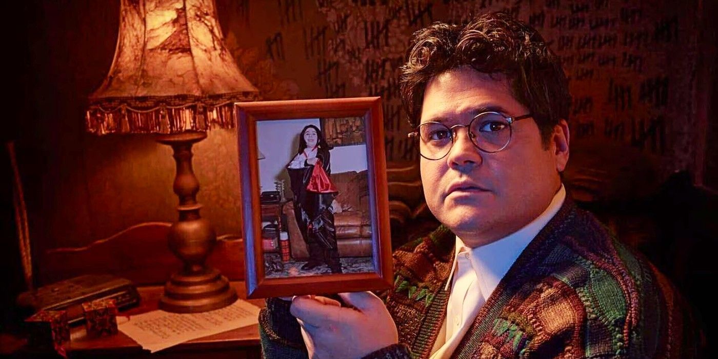 Guillermo De La Cruz holding up a picture of himself dressed as Armand from Interview with the Vampire