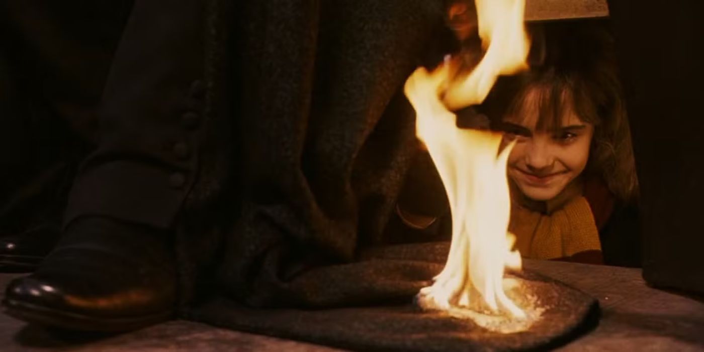 Hermione Granger (Emma Watson) sets Professor Snape's (Alan Rickman) cloak on fire in 'Harry Potter and the Sorcerer's Stone'