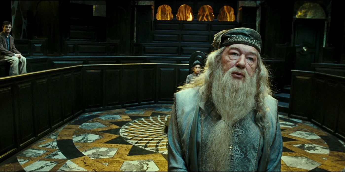 Dumbledore stands in a grand room with others in Harry Potter and the Order of the Phoenix.