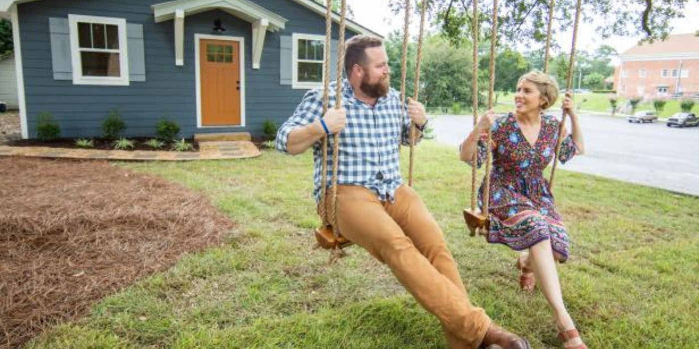 Ben and Erin Napier on swings on the set of &lsquo;Home Town.'