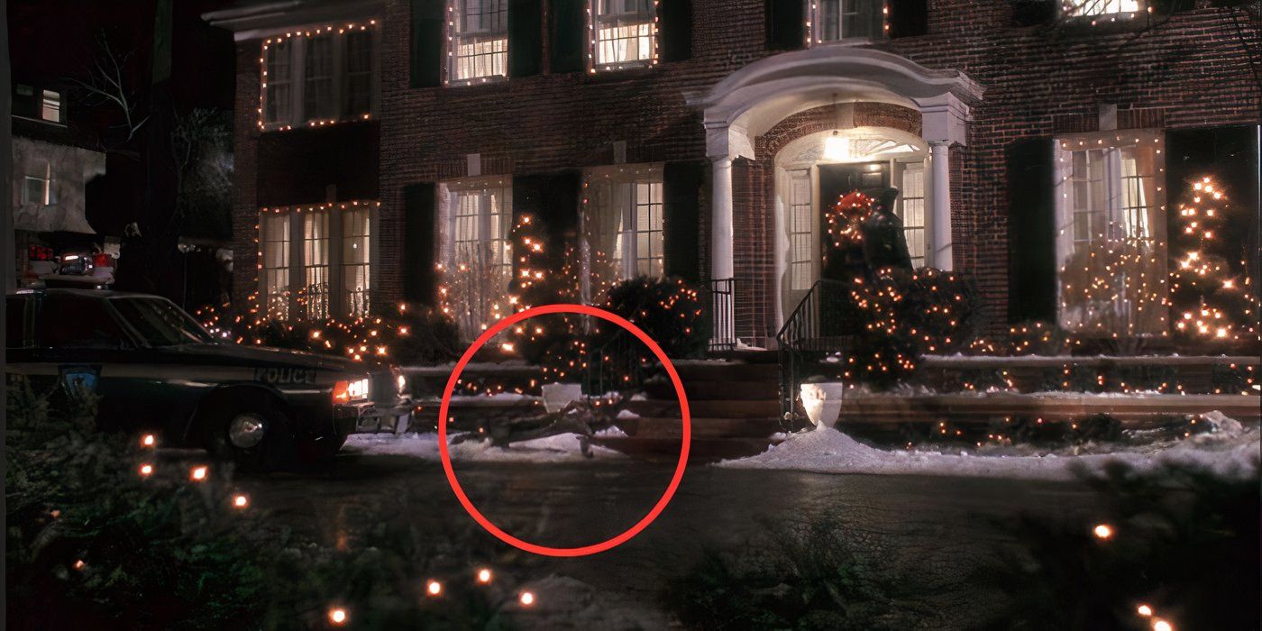 A police officer at the front door of a house next to a fallen statue in &lsquo;Home Alone&rsquo;