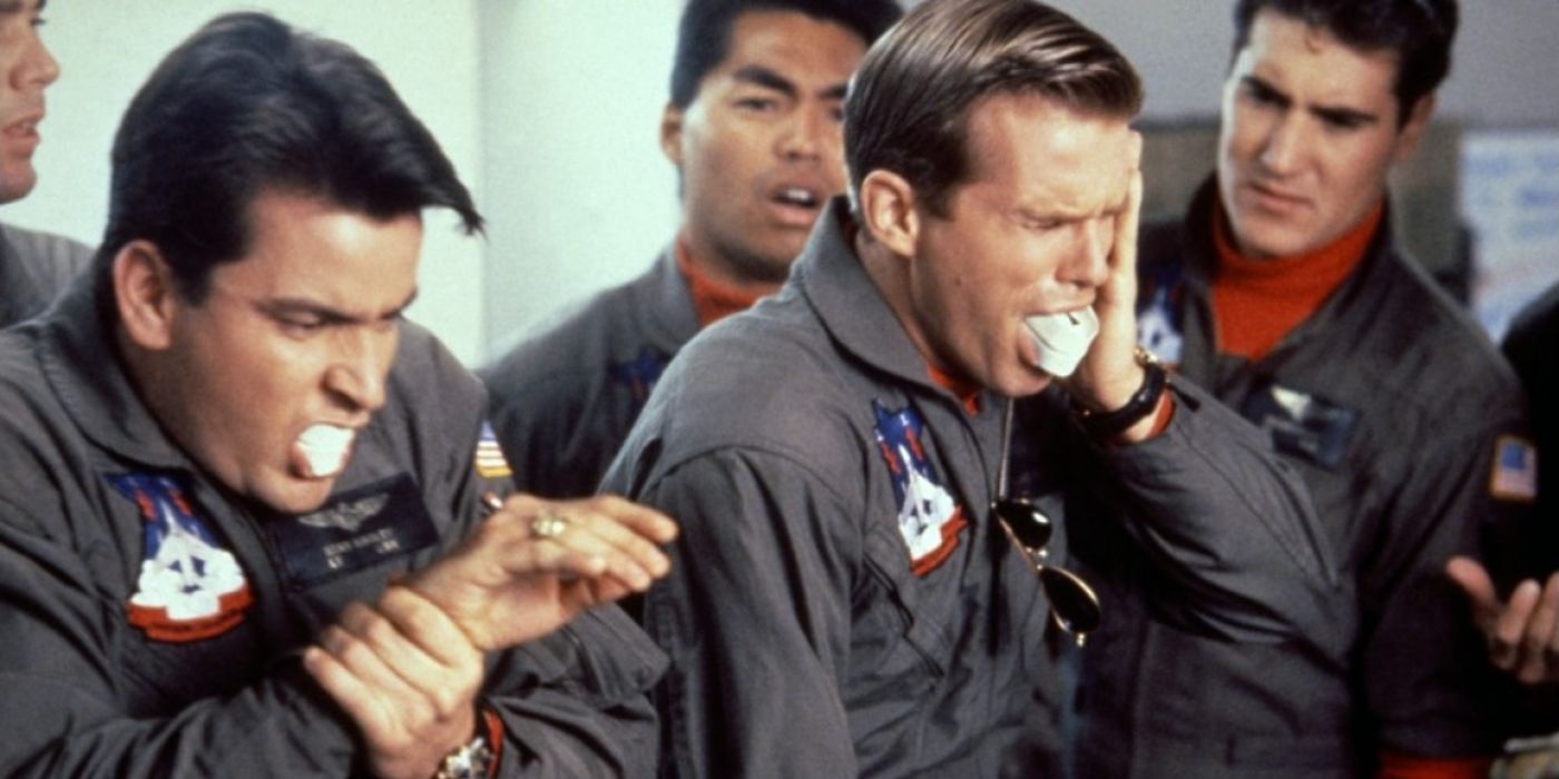 Charlie Sheen and Cary Elwes wear pilot uniforms and bite down on mouth guards in Hot Shots.