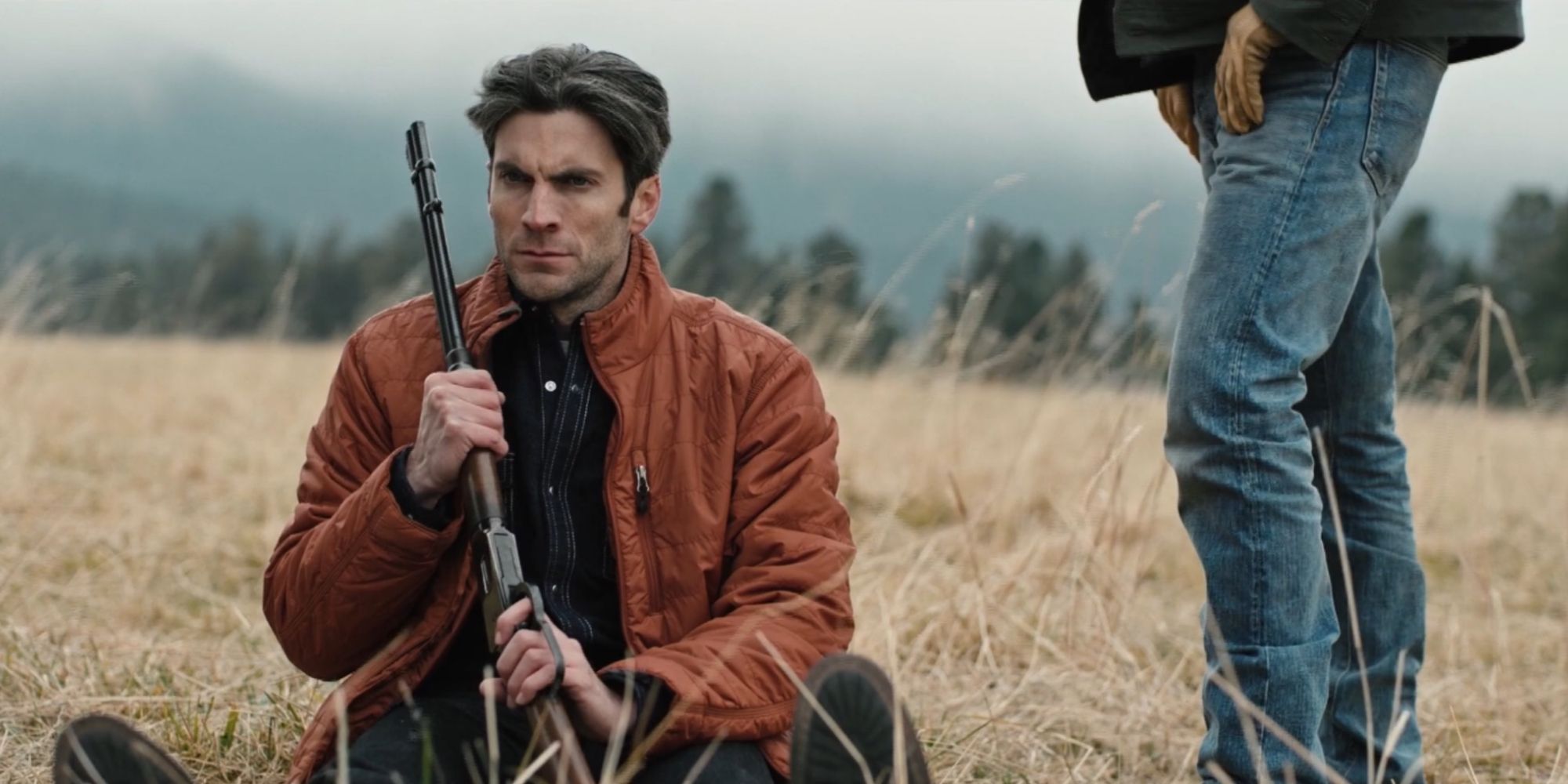 Jamie Dutton (Wes Bentley) sits in the field holding a gun in Season 2, Episode 7 of 'Yellowstone.'