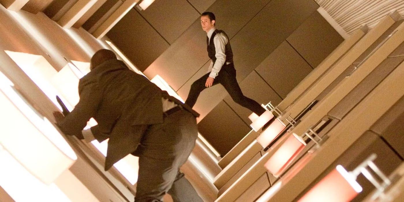 Arthur running through a revolving hallway in Inception