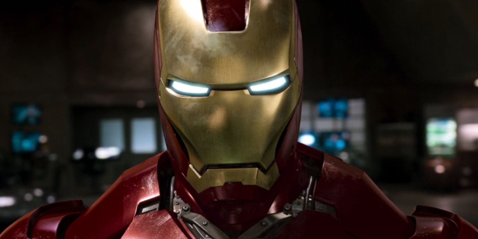 Tony Stark, played by Robert Downey Jr., wears the full Iron Man suit in 'Iron Man'.