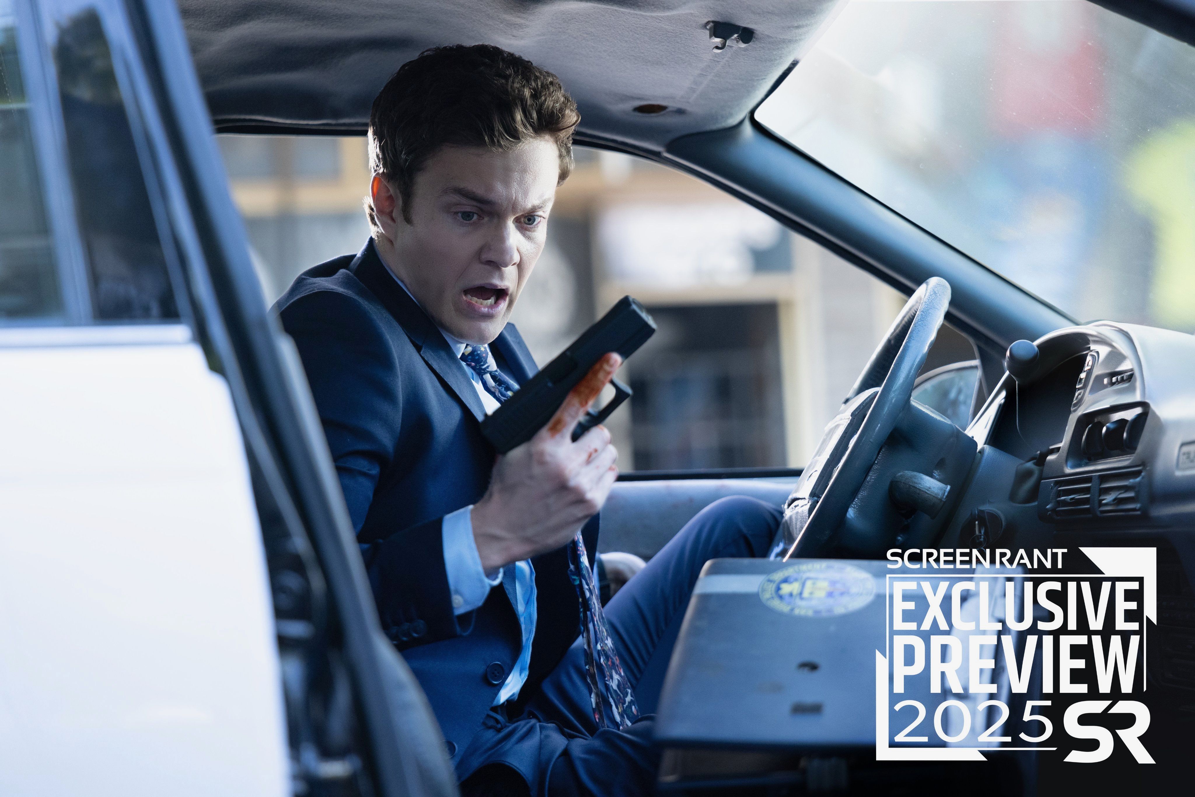 Jack Quaid holding a gun in a car in Novocaine