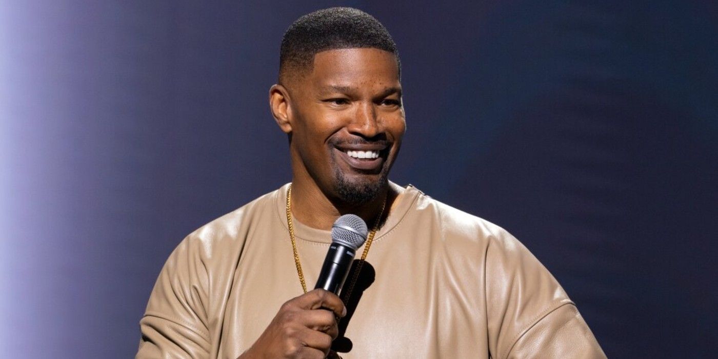 Jamie Foxx on stage talking into a mic for Netflix's What Happened Was