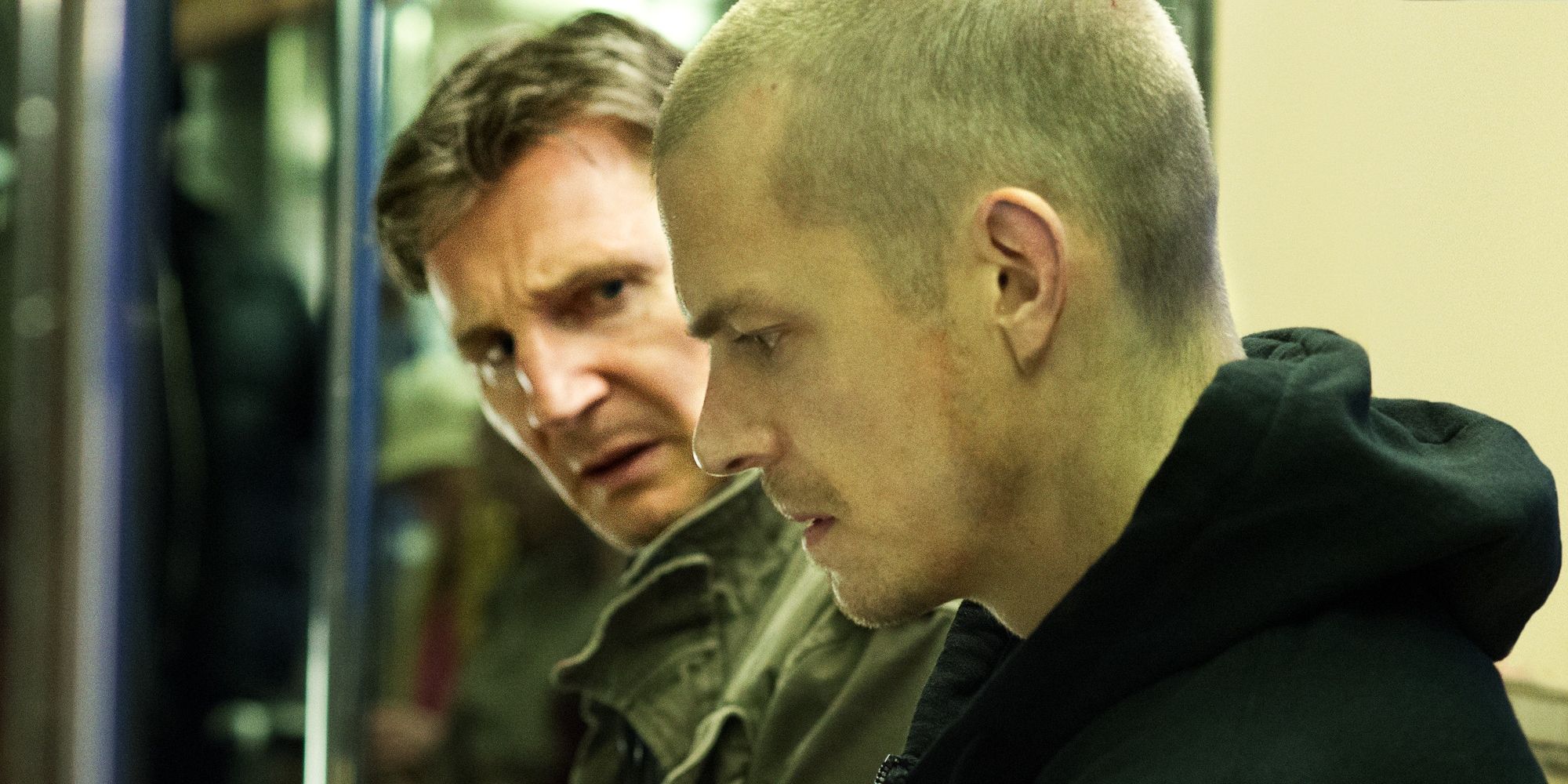 Jimmy (Liam Neeson) and Mike (Joel Kinnaman) on a train in &lsquo;Run All Night&rsquo;