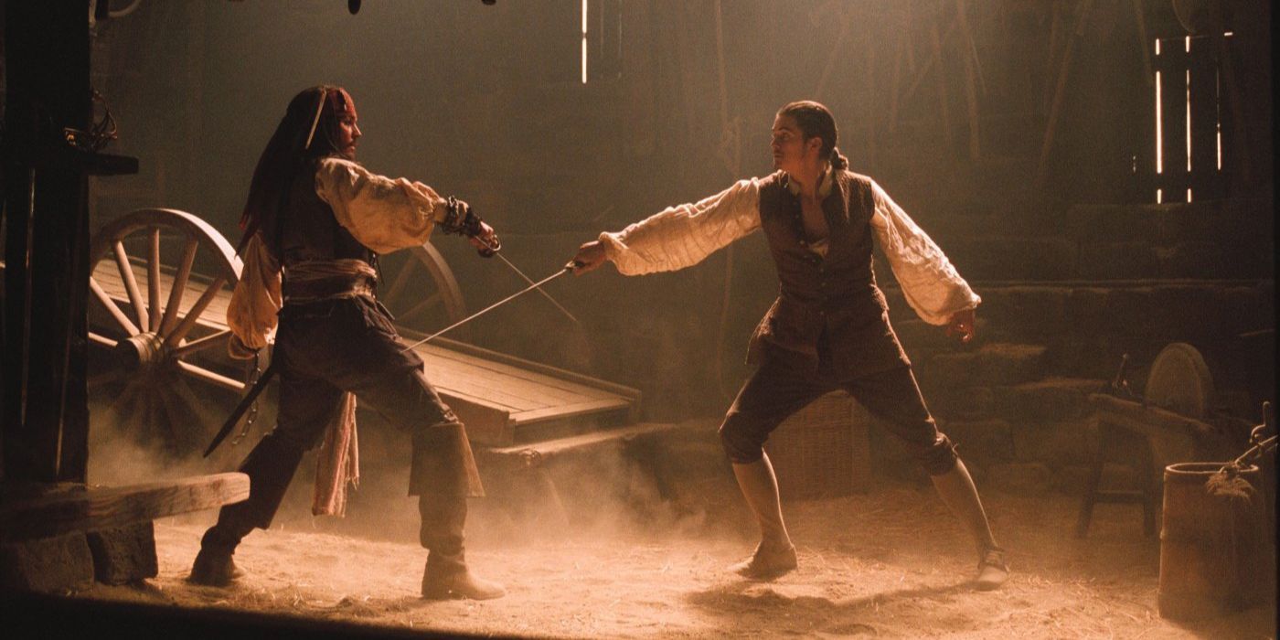 Jack Sparrow and Will Turner cross swords in Pirates of the Caribbean the Curse of the Black Pearl