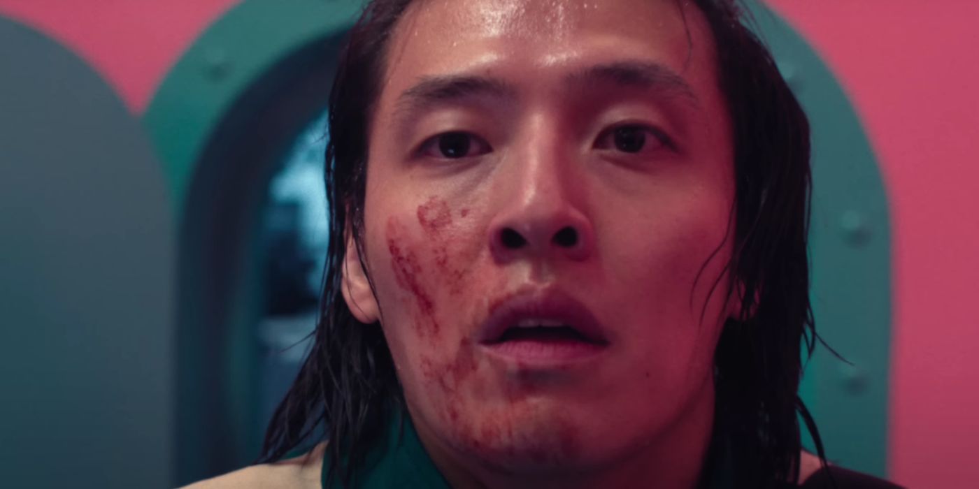 Kang Ha-neul with a bloody hand print on his face in 'Squid Game' Season 2.