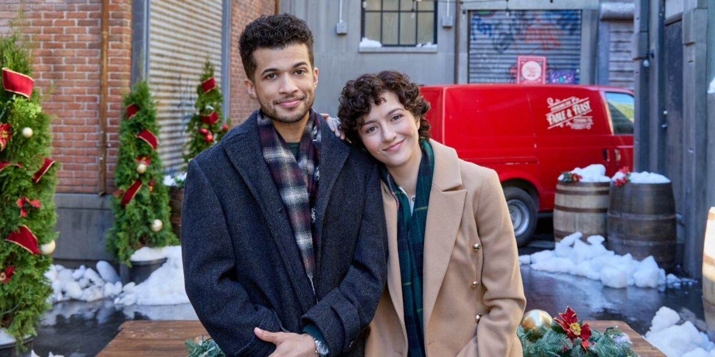 Jordan Fisher and Kate Findlay standing next to each other in &lsquo;The 5-Year Christmas Party&rsquo;.
