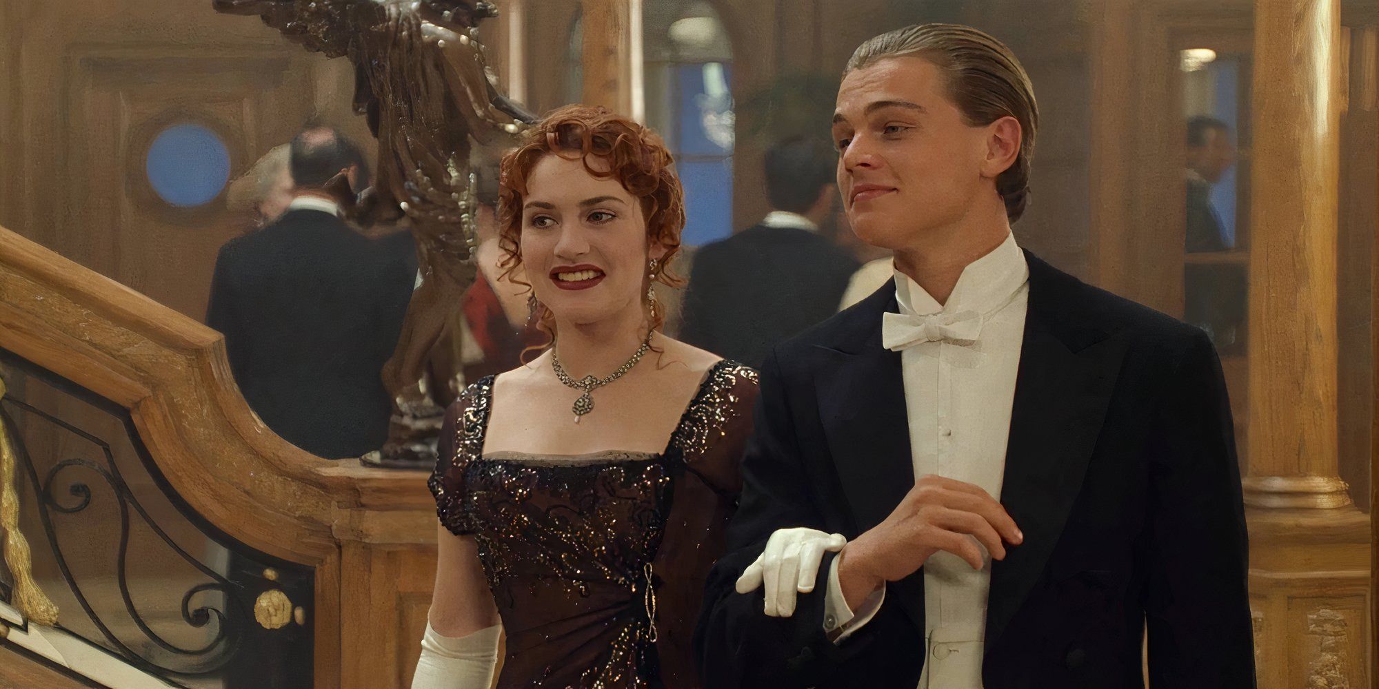 Kate Winslet as Rose and Leonardo DiCaprio as Jack in Titanic walking side by side.