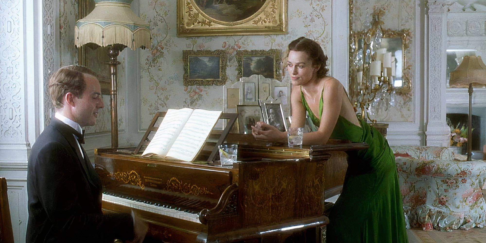 Keira Knightley as Cecilia in Atonement leaning over a piano.