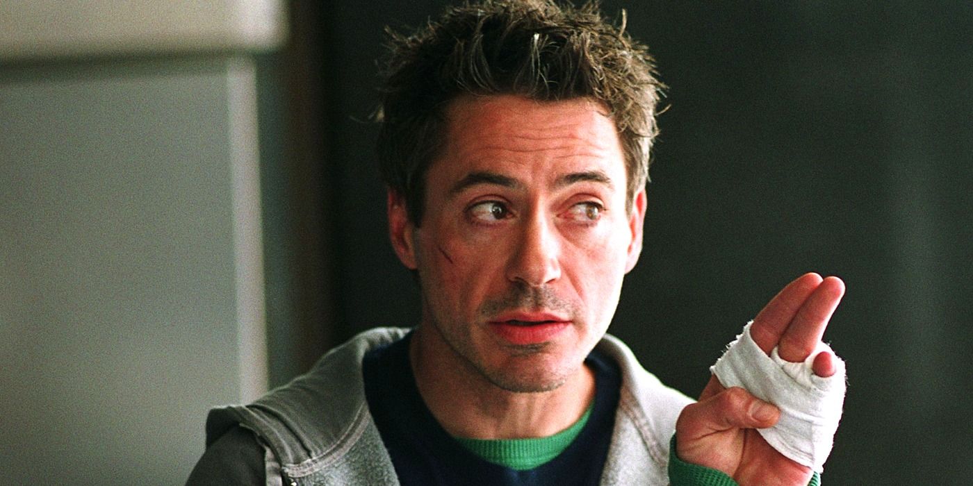 Robert Downey Jr. as Harry Lockhart with a bandaged hand in 'Kiss Kiss Bang Bang'