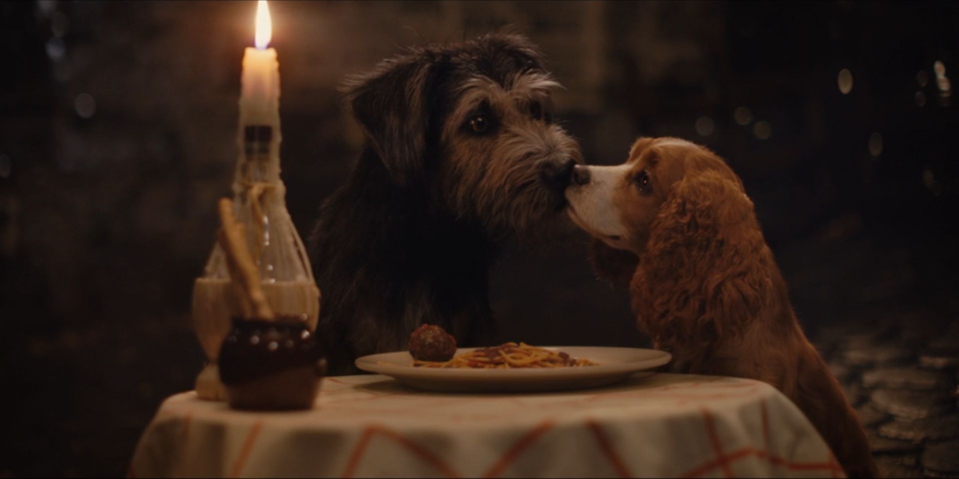 Lady, voiced by Tessa Thompson, and Tramp, voiced by Justin Theroux, kiss in 'Lady and the Tramp'.