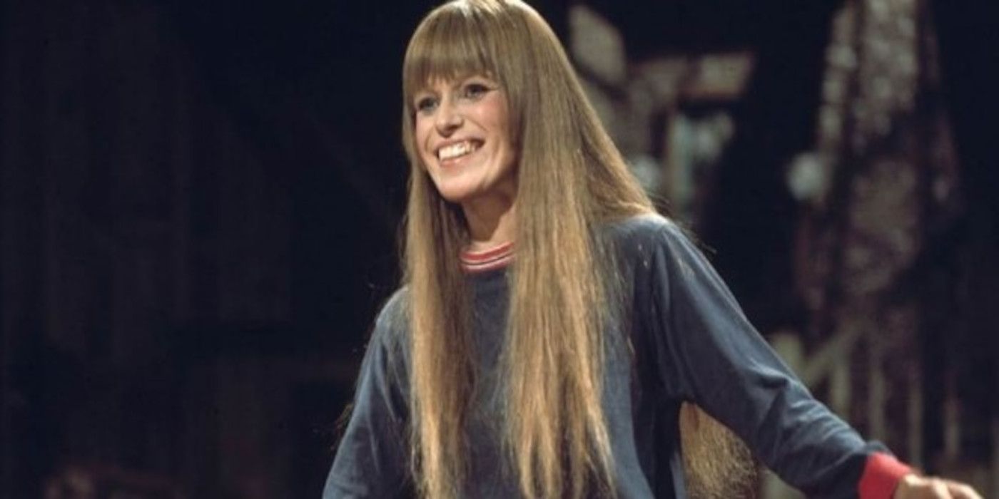 Louise Lasser smiling onstage on Saturday Night Live