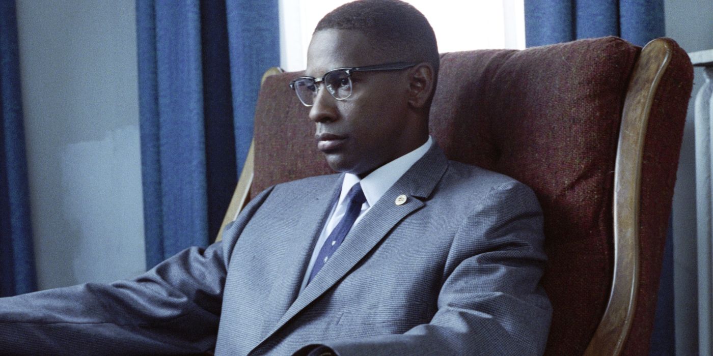 Malcolm (Washington) sitting in a chair in?Malcolm X