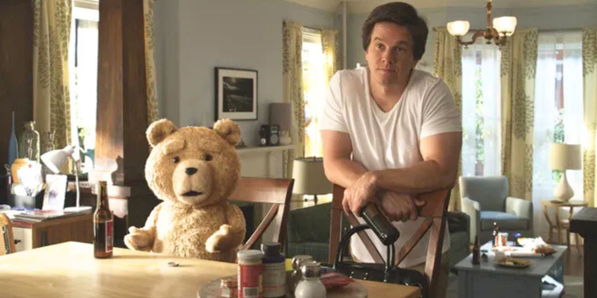 Mark Wahlberg standing next to Ted who is voiced by Seth MacFarlane in Ted (2012)