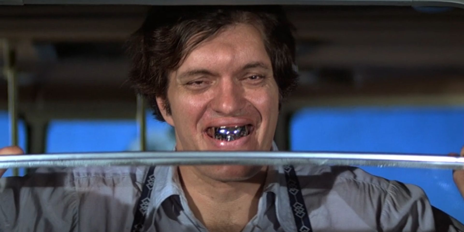 Jaws, played by Richard Kiel, smiles while in a cable car in 'Moonraker'.