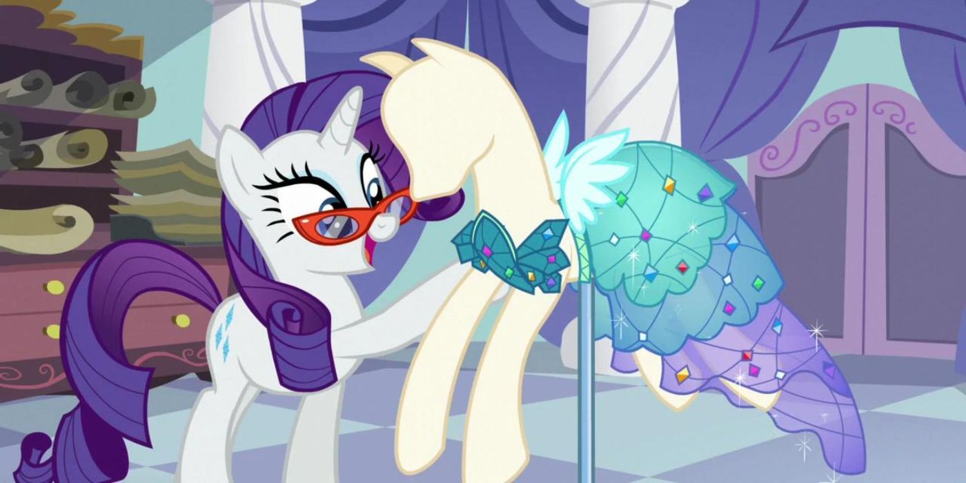 Rarity wears her glasses as she works on a dress