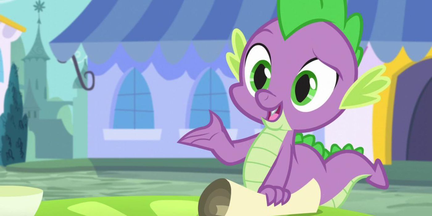 Spike with his hand on a scroll