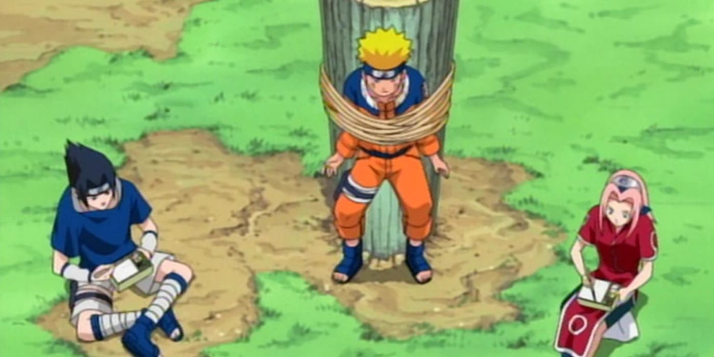 Naruto tied to a tree while Sasuke and Sakura eat lunch in Naruto.