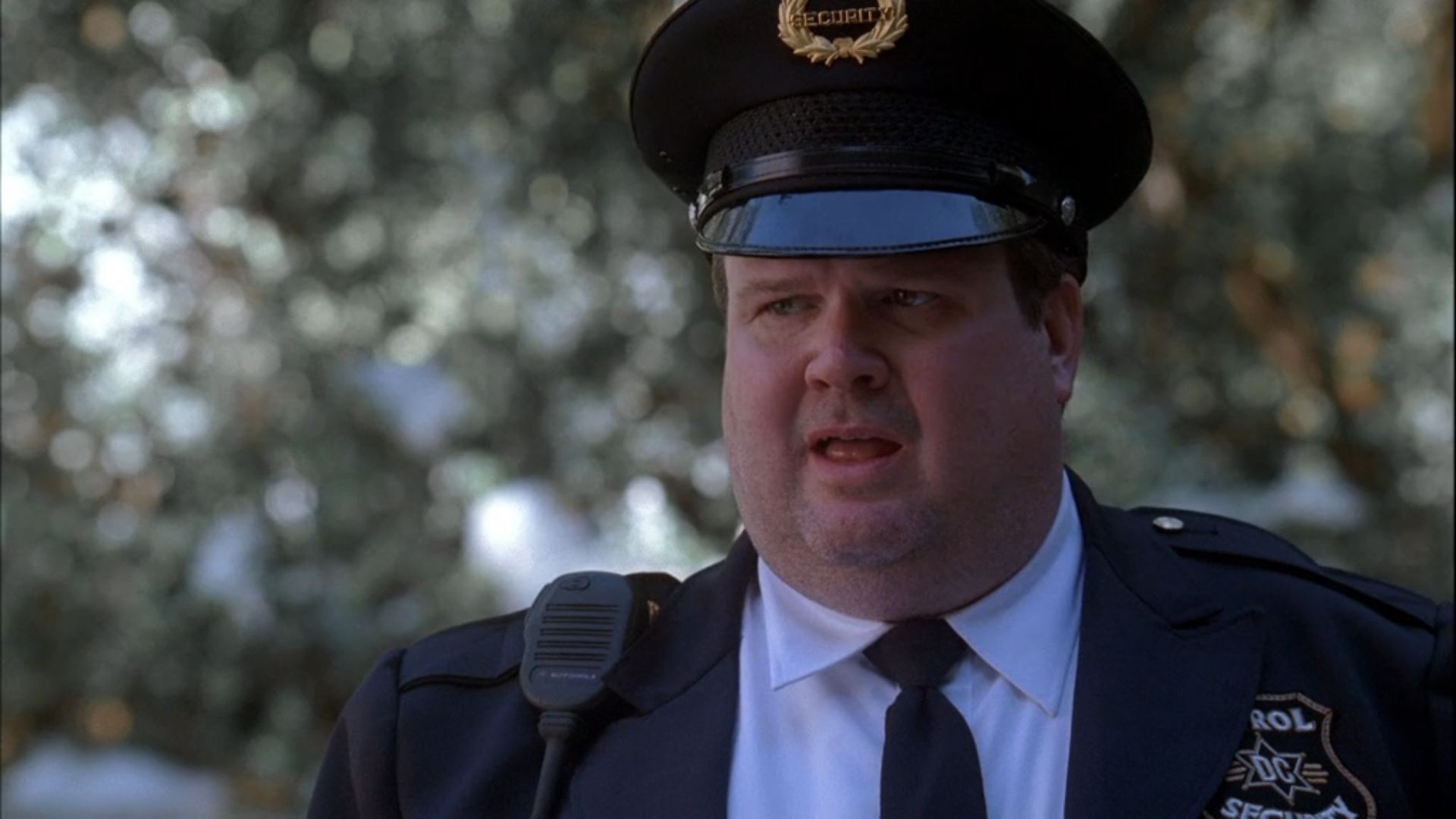 Harvey Ames (Eric Stonestreet) in his security officer uniform in NCIS