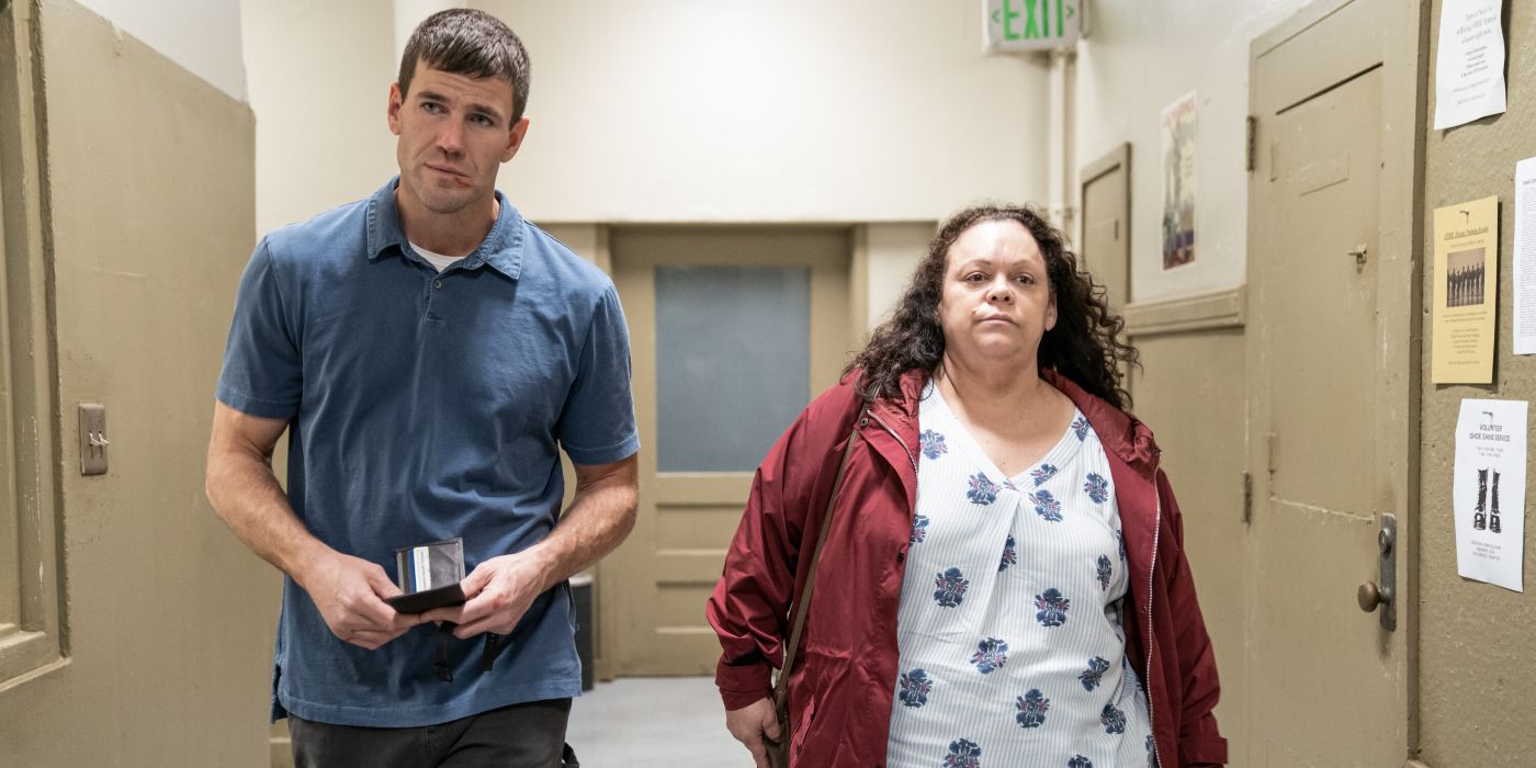 Leroy Jethro Gibbs (Austin Stowell) and Ruth (London Garcia) walking past jail cells in NCIS: Origins