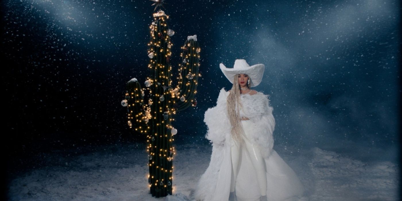 Beyoncé poses next to a lit up Christmas cactus to promote her NFL halftime performance on Netflix.