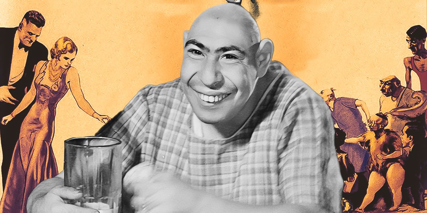 Schlitzie, as shown in the movie Freaks, sits smiling and holding a beer glass in front of the movie's poster.