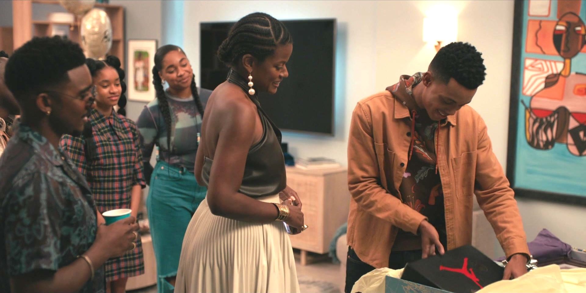 Will Smith with his family cutting a cake on his birthday in Bel-Air season 1.