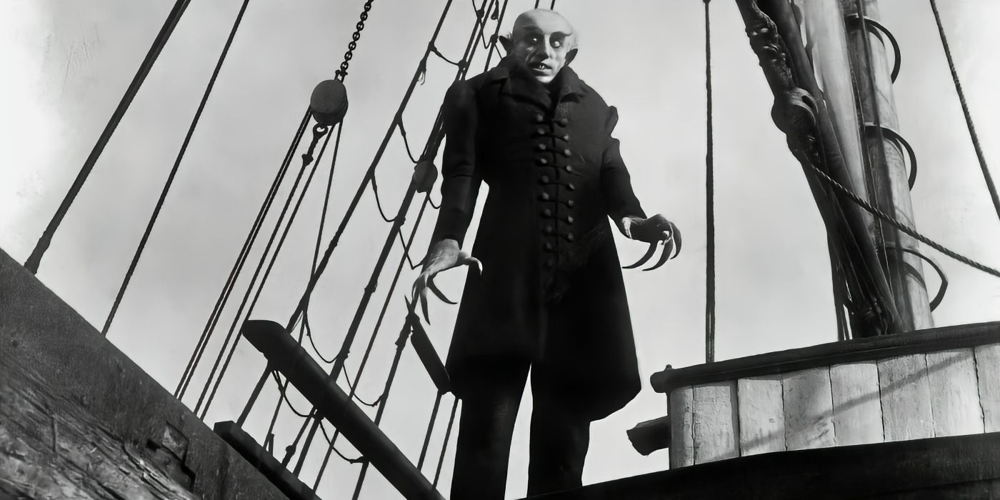 Max Schreck stands aboard a ship looking menacing in 1922's Nosferatu