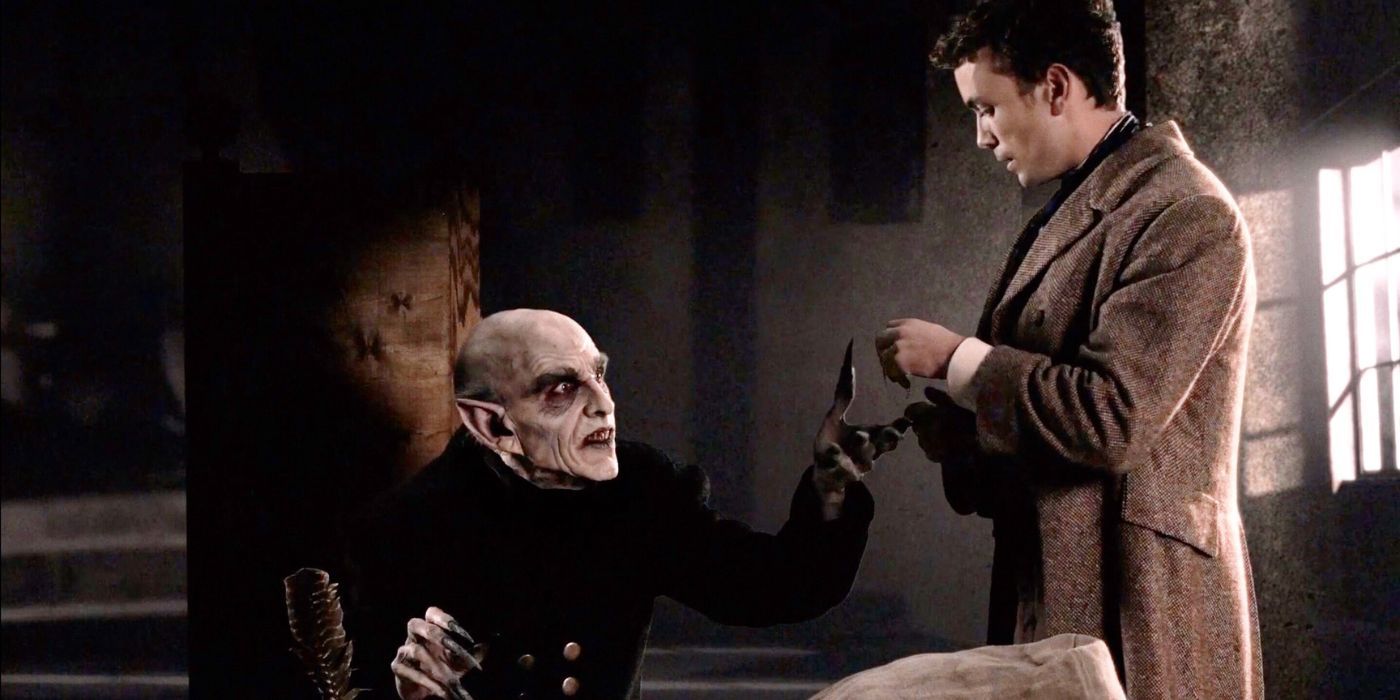 Count Orlok, portrayed by Doug Jones in David Lee Fisher's?Nosferatu: A Symphony of Horror,?reaches toward Thomas Hutter's (Emrhys Cooper) hands during a meeting.?