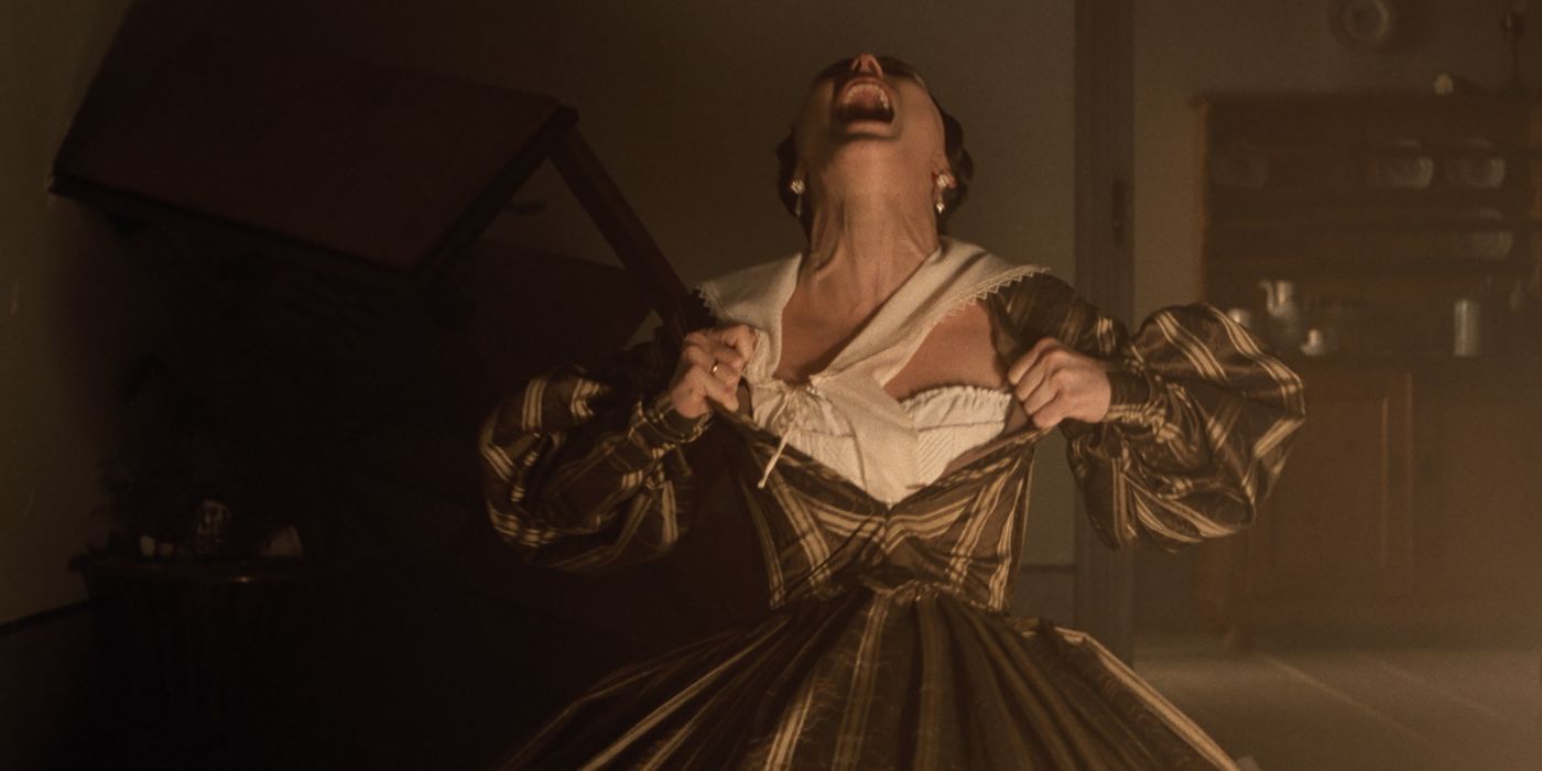 Lily-Rose Depp as Ellen Hutter ripping open her dress and screaming in agony in Nosferatu.