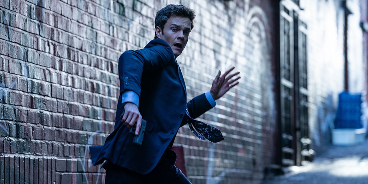 Jack Quaid as Nathan "Nate" Caine running through an alley in Novocaine 