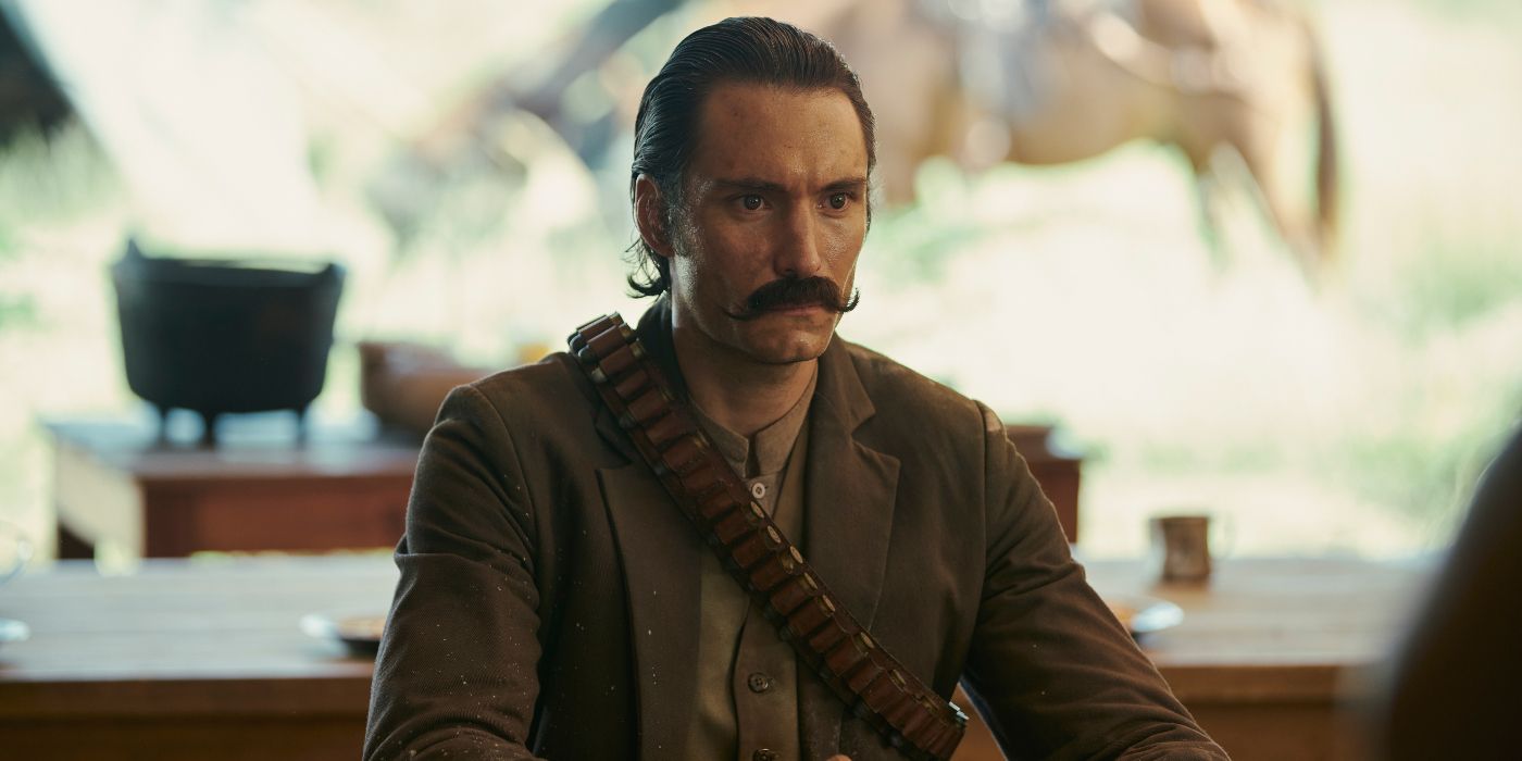 Claudio Catano as Colonel Aureliano Buendia sitting at a table
