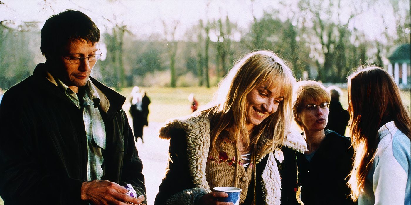 A man stands next to a woman smiling in Open Hearts