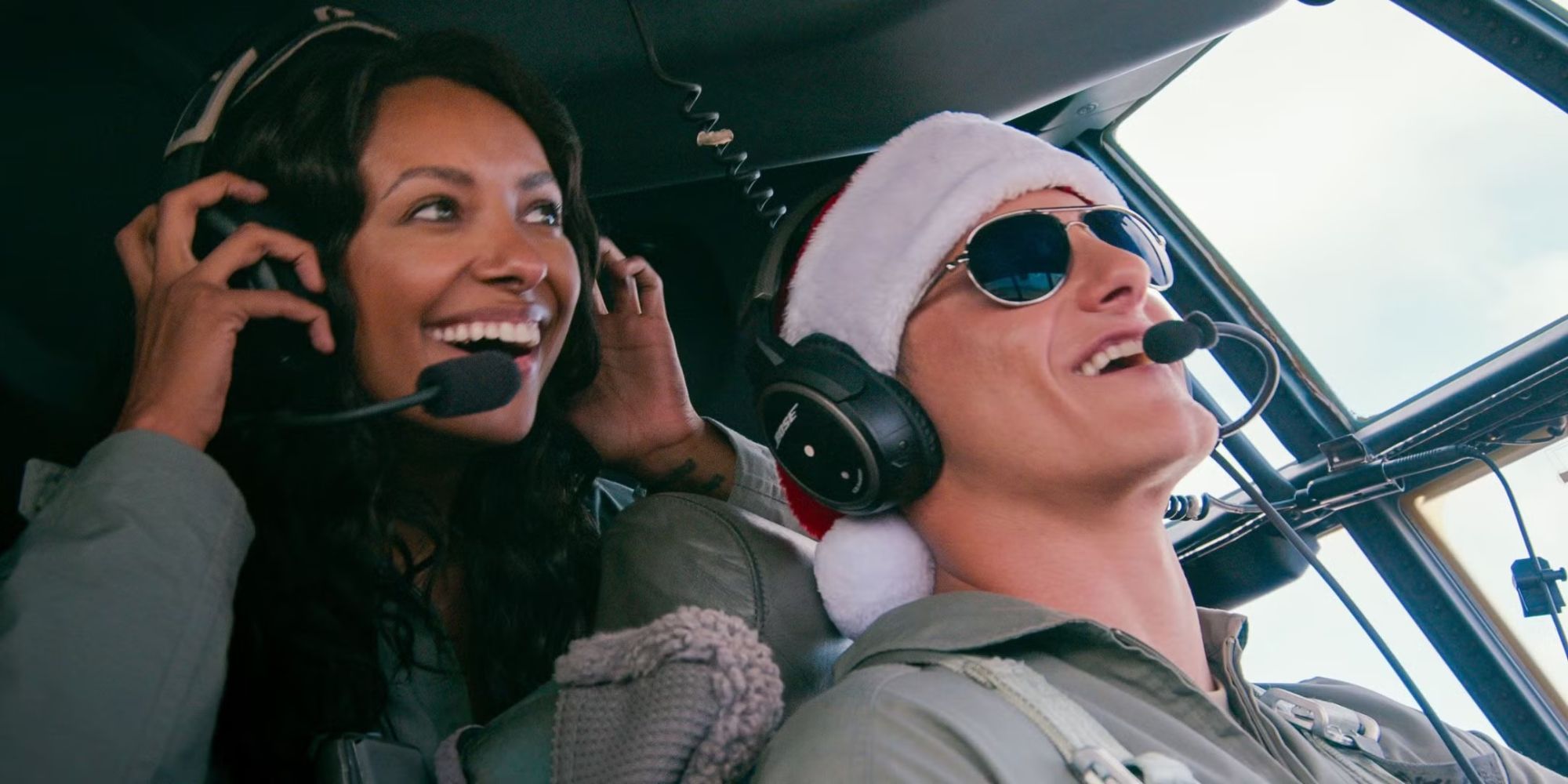 Kat Graham as Erica and Alexander Ludwig as Andrew in a plane cockpit in Operation Christmas Drop.