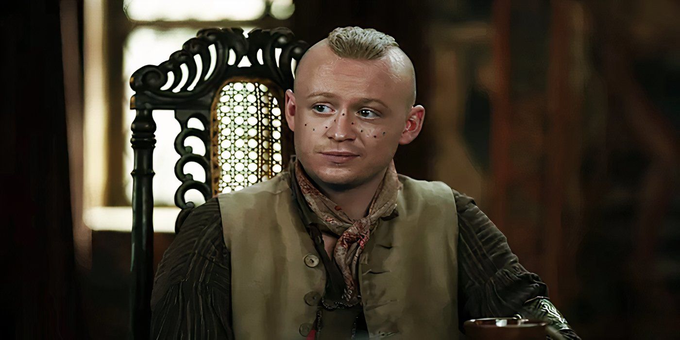 Outlander, Season 7, Episode 13, Young Ian sitting and wearing a small smile.