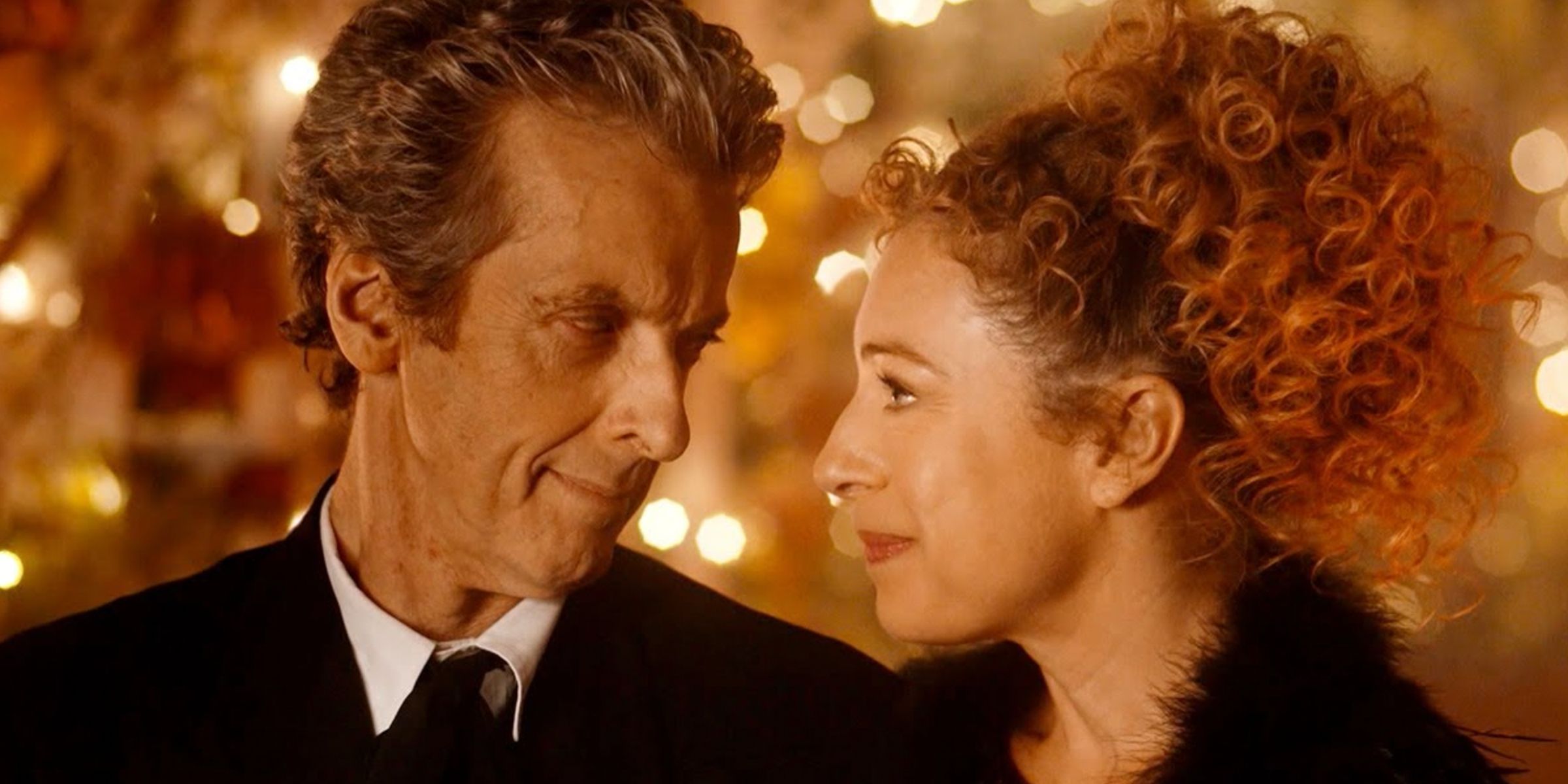 Peter Capaldi as the Twelfth Doctor and Alex Kingston as River Song gazing into each other's eyes.