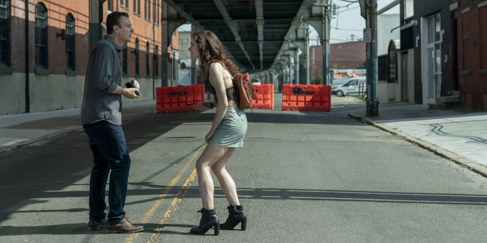 Peter and Simone talk on the street in &lsquo;Dispatches from Elsewhere&rsquo;.