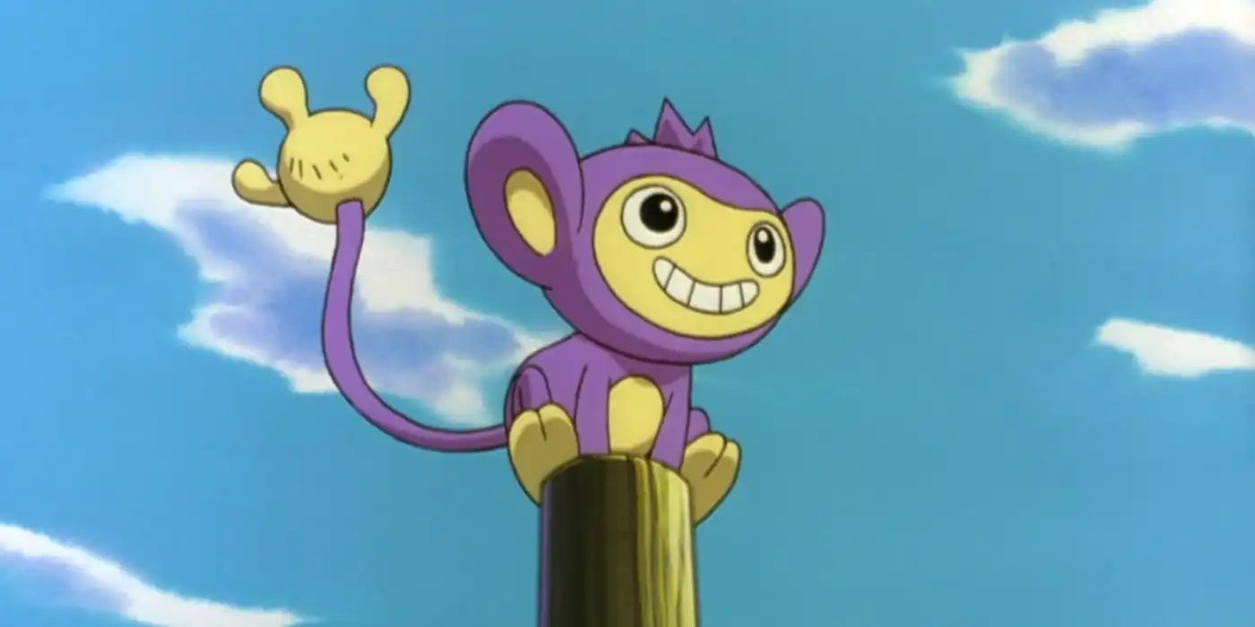 Aipom sitting on a pole smiling in the Pokémon anime.