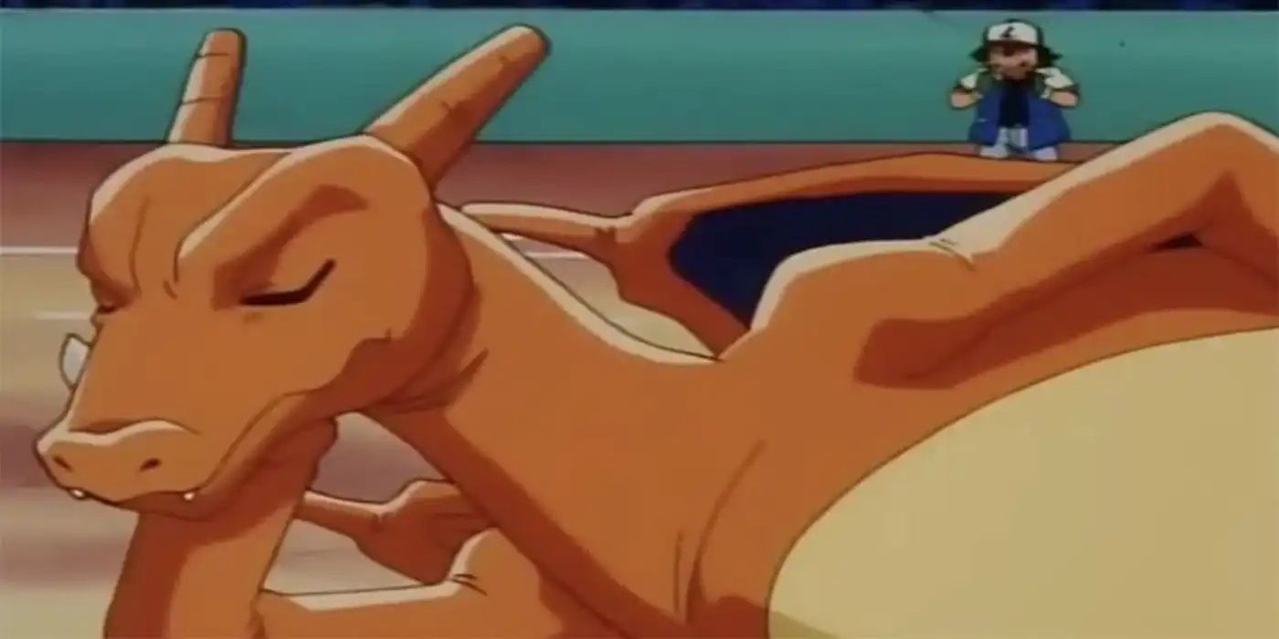 Charizard laying on the floor resting while Ash screams behind him in the Pokémon anime.