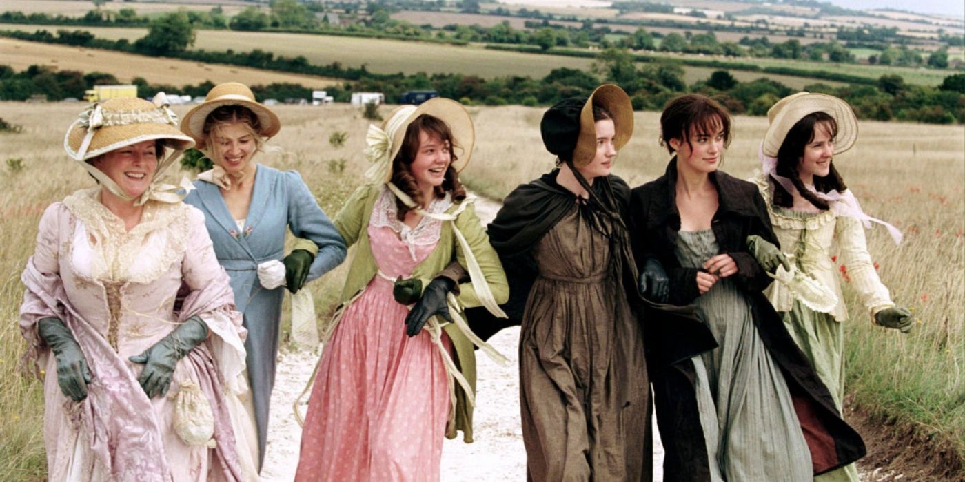 The Bennet sisters, including their mother, holding each other as they walk along the field.