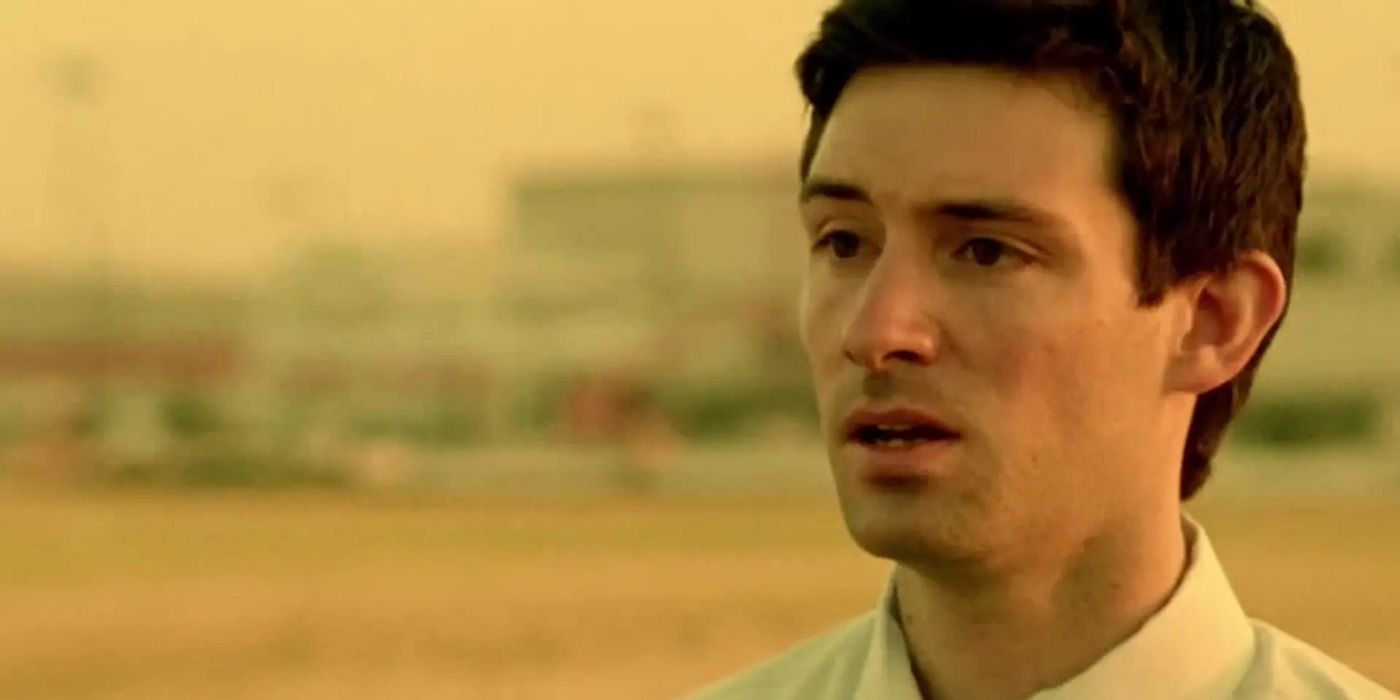 Shane Carruth as Aaron looking at a person offscreen in Primer